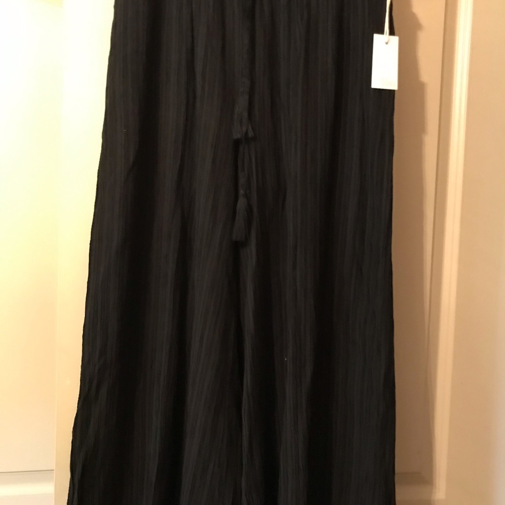 Women’s long black dress pants.